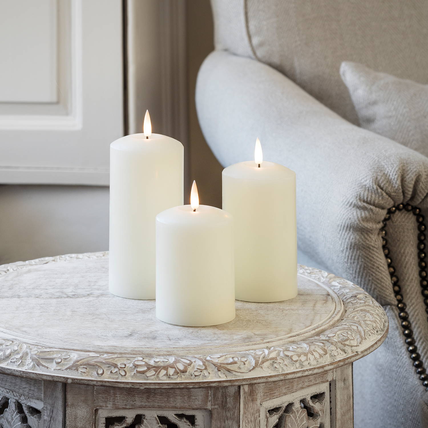 true glow realistic flame led pillar candle trio on coffee tabletable