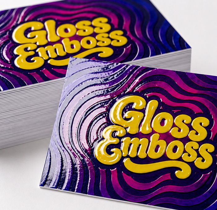 Gloss Emboss business cards with raised gloss finish on soft touch card stock