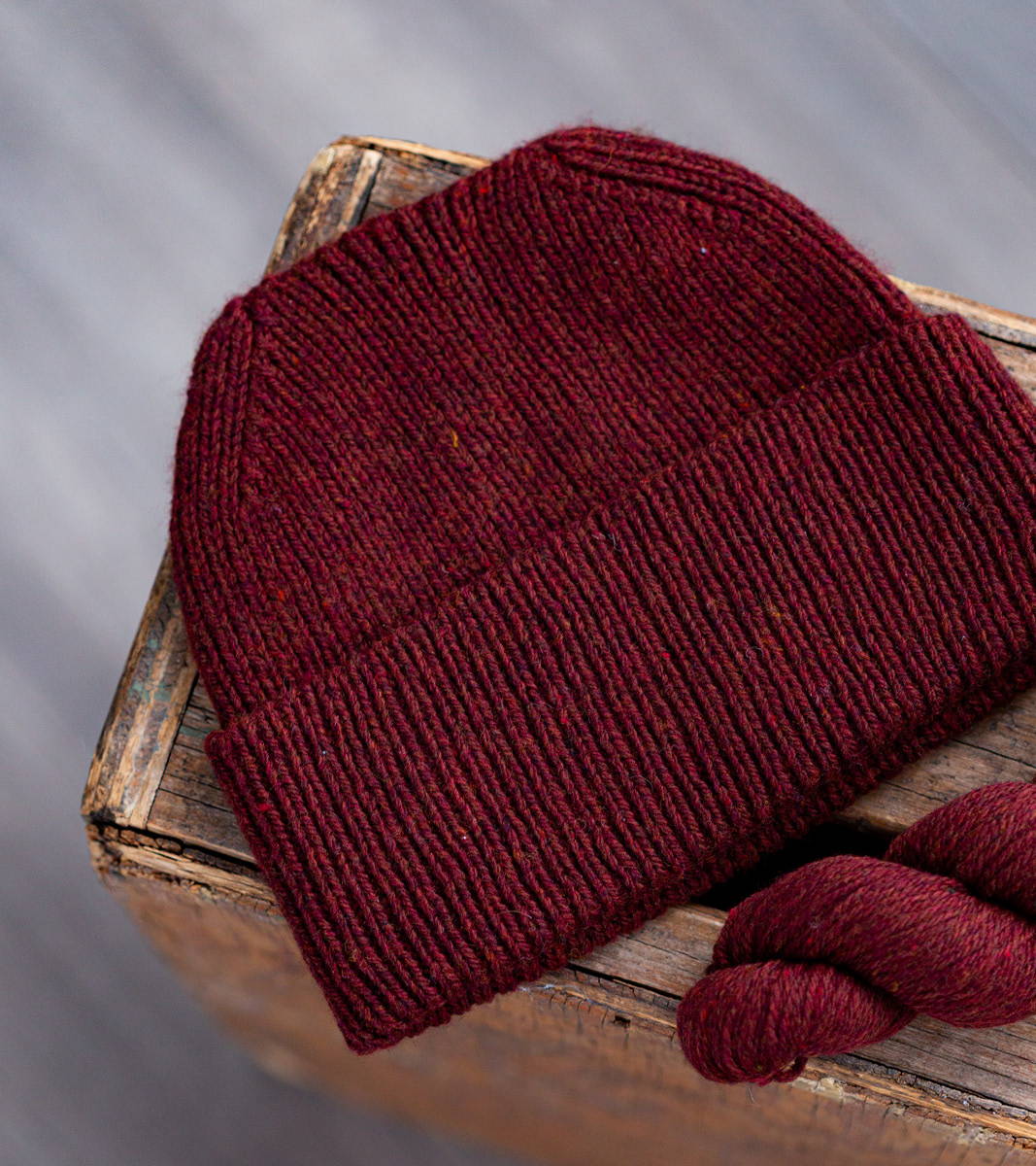 Brooklyn Tweed's Hansmire Hat hand knit in Imbue Sport yarn color Cloak.