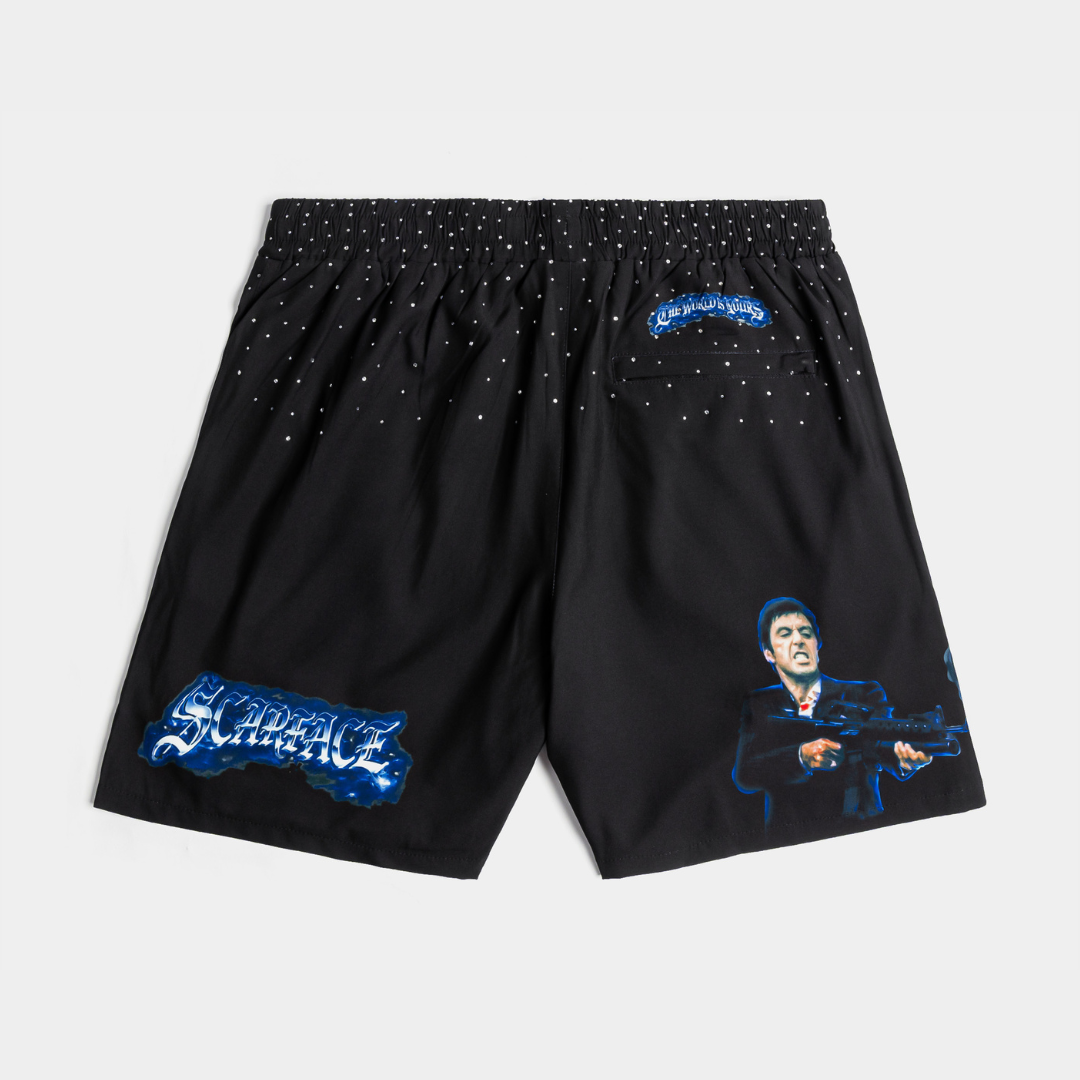 Black shorts with blue graphic designs and text on the sides.