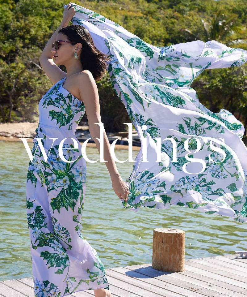 weddings | Woman wearing lavendar floral printed silk formal dress with matching silk scarf by the water by Ala von Auersperg