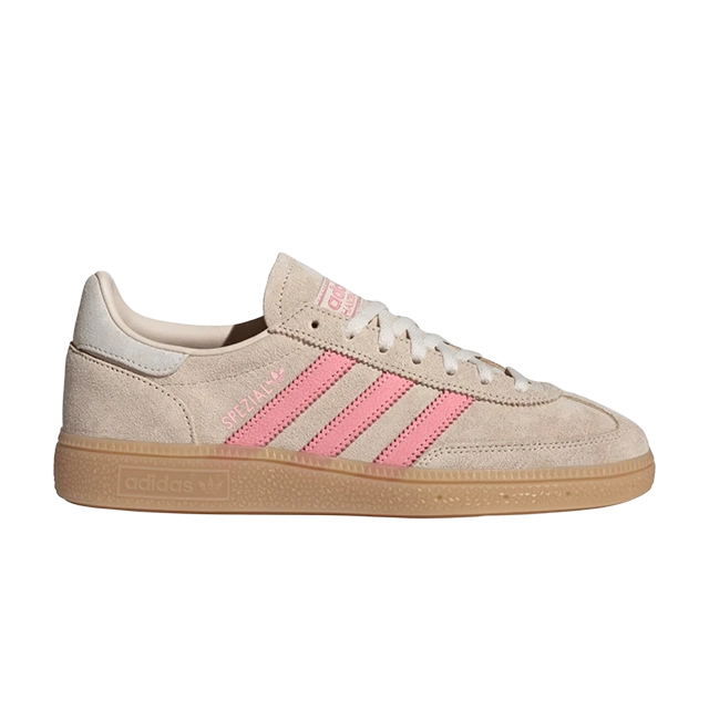 Beige sneakers with pink stripes and gum sole.
