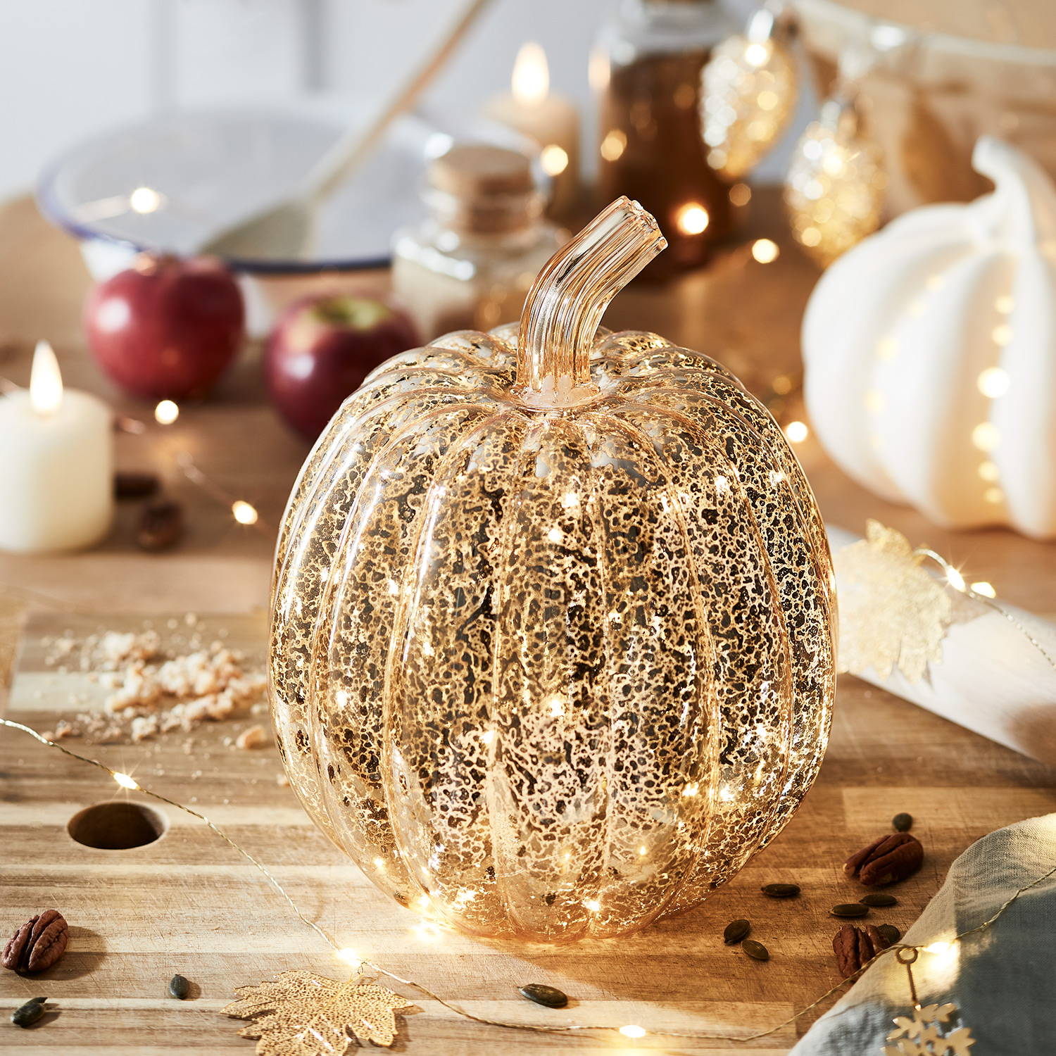 Gold glass pumpkin light in a traditional autumnal setting