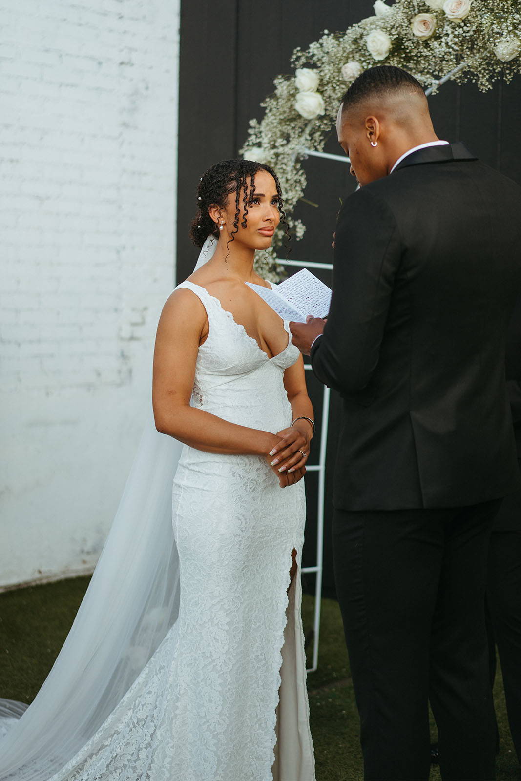 Bride and groom at ceremony saying vows