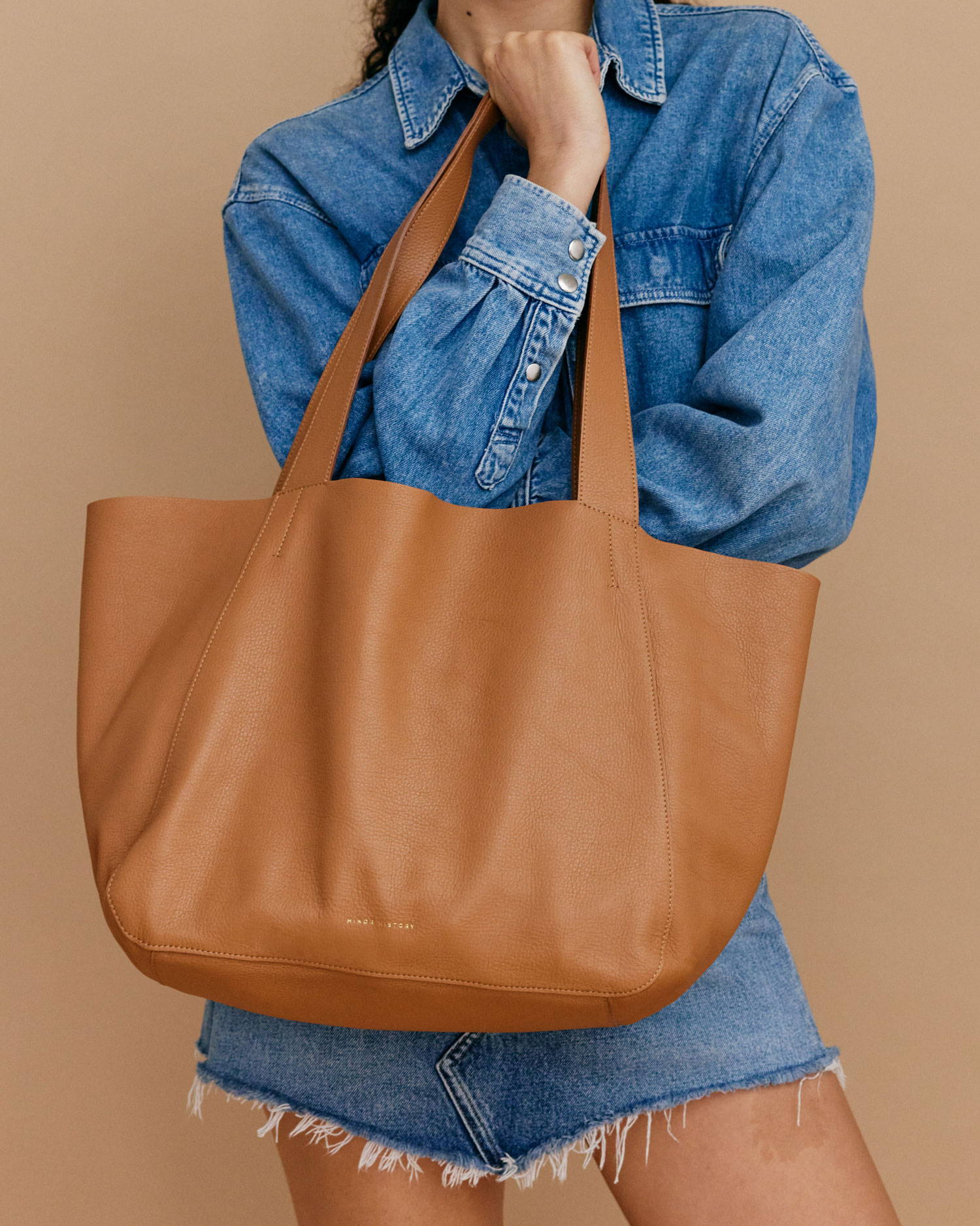 Large soft brown tote with denim skirt