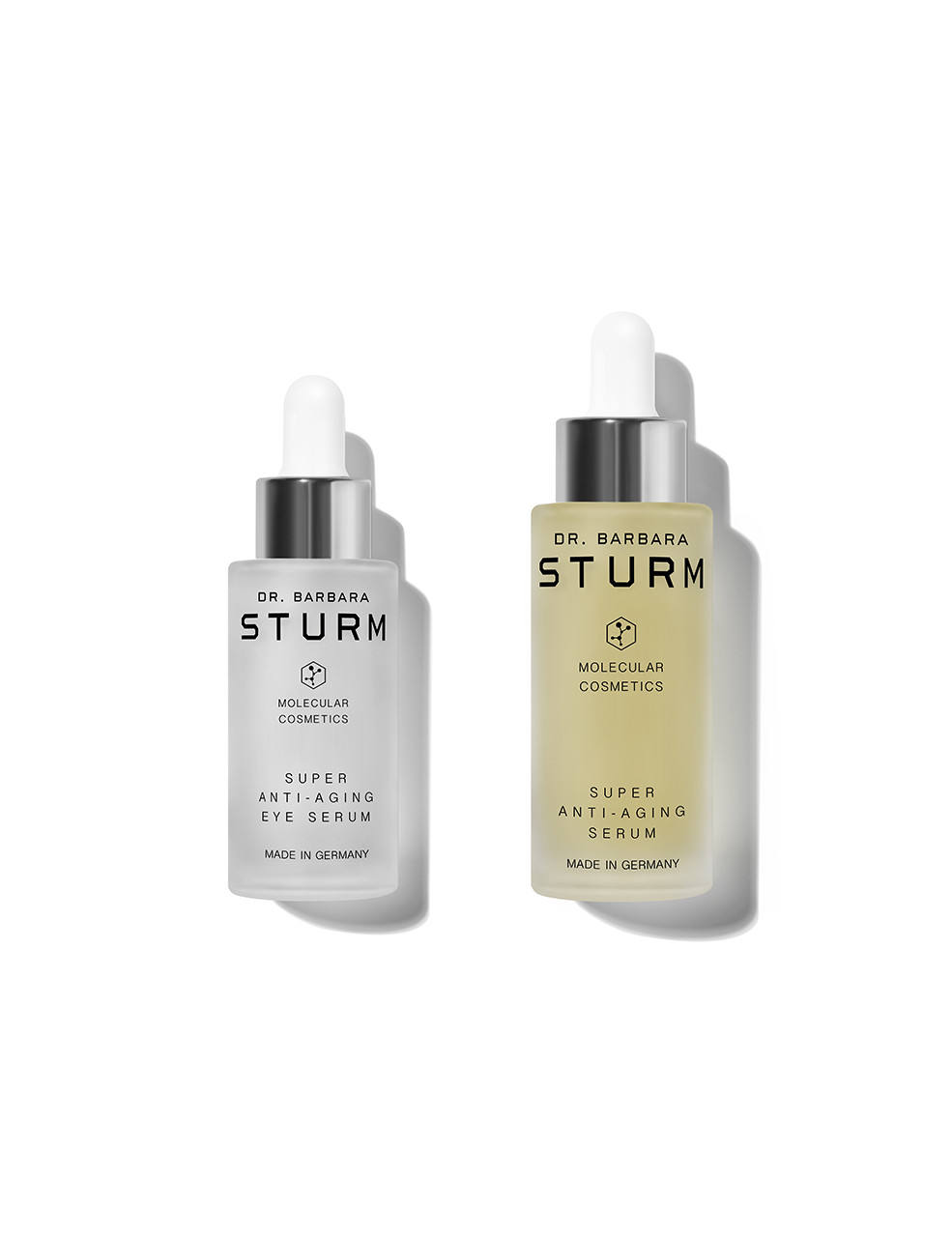 Two bottles of Dr. Barbara Sturm skincare serums on a white background.