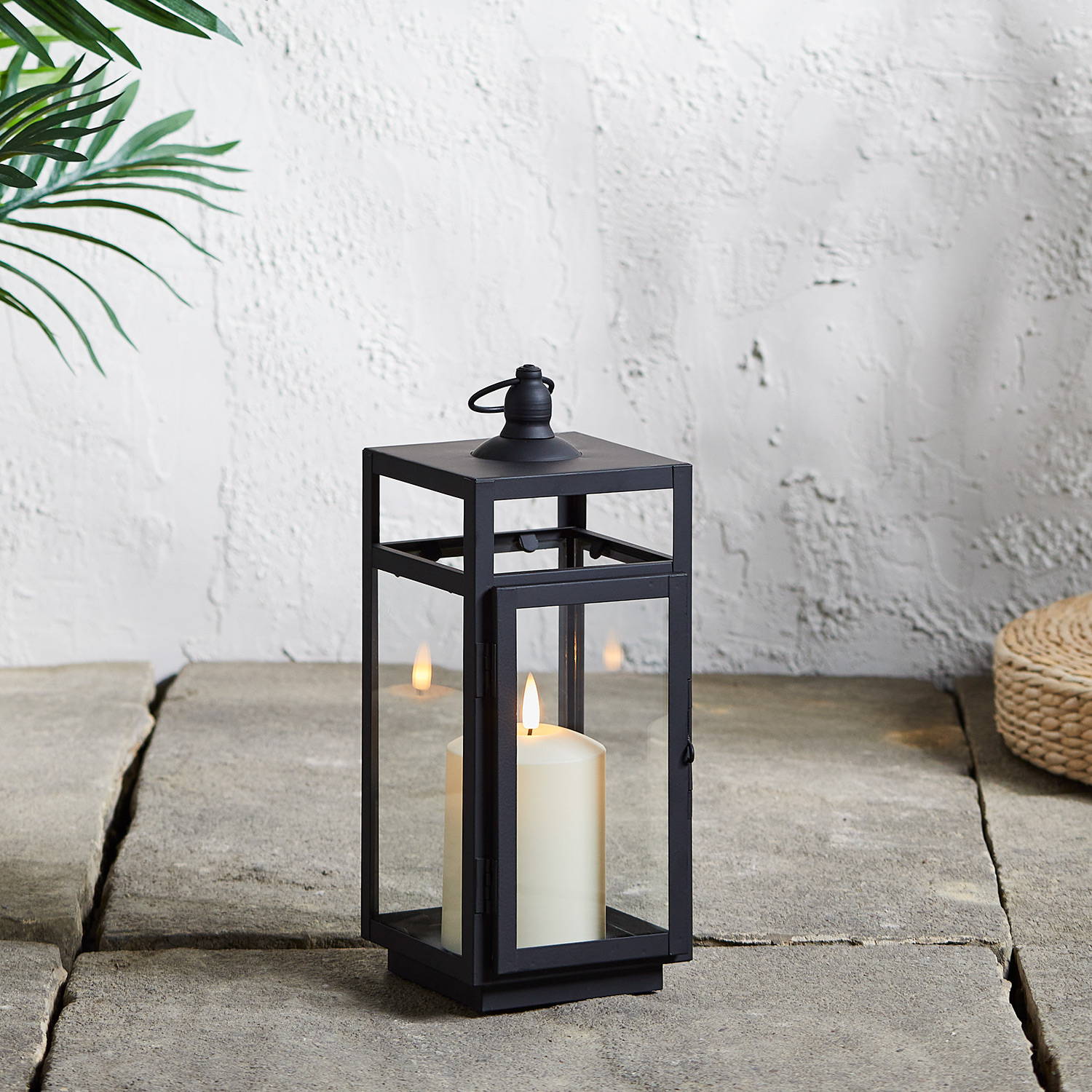Bunbury lantern illuminated on patio floor