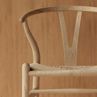 Wooden chair against a simple wooden background.