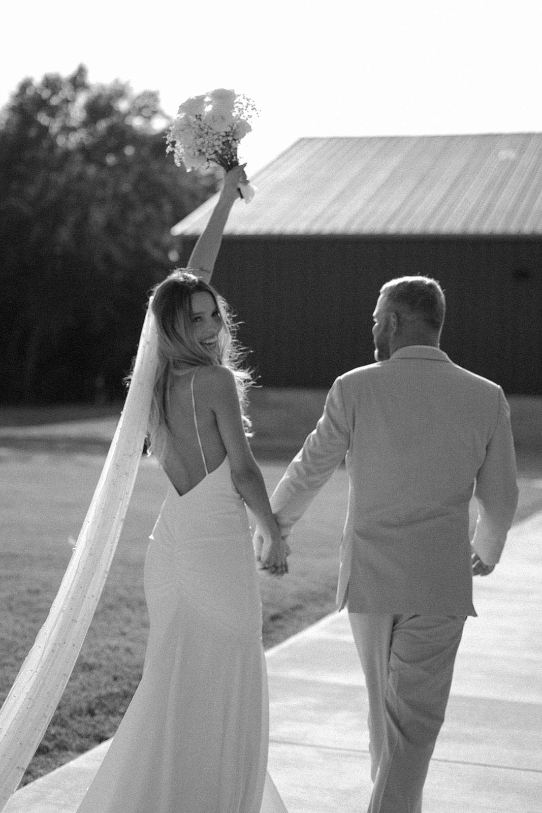 Bride and Groom holding hands