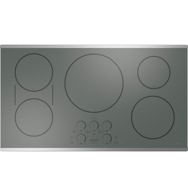 A flat, gray electric cooktop with five burner zones.