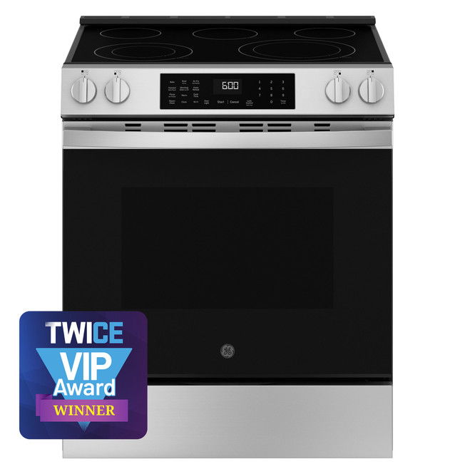 A modern stainless steel range with a digital display and award badge.