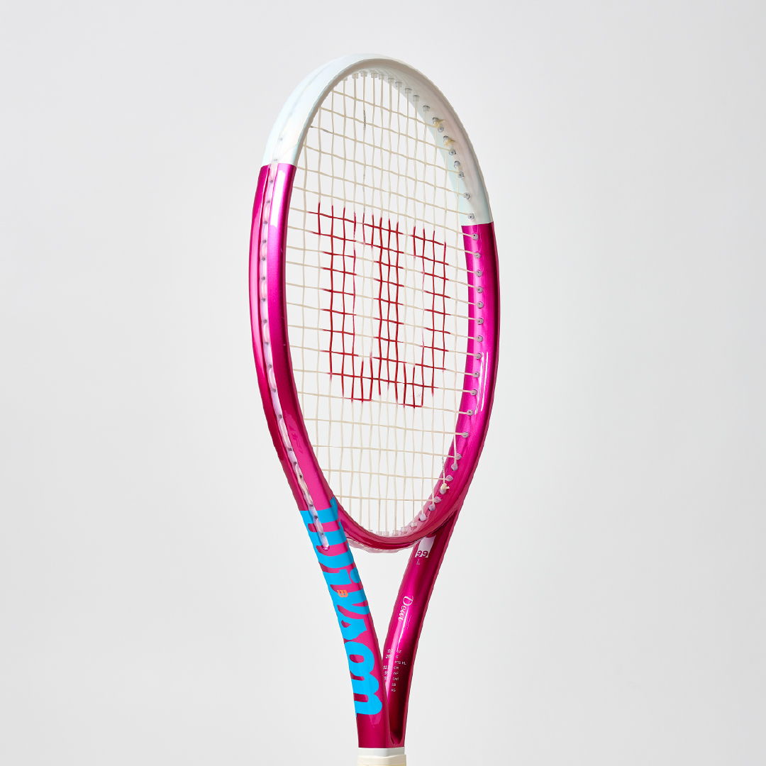 Pink and blue tennis racket against a plain background.
