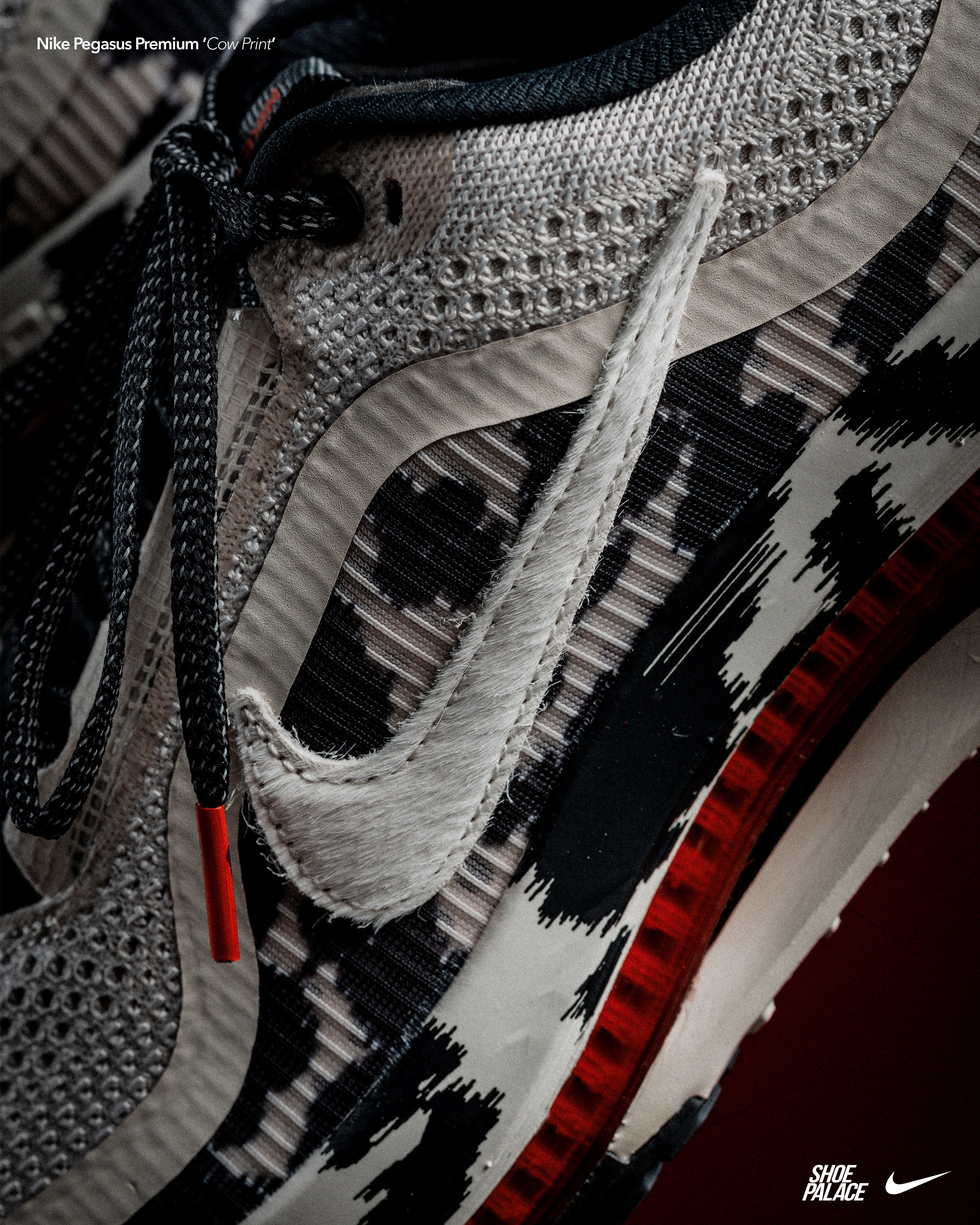 Close-up of a Nike shoe with a unique pattern and red sole.