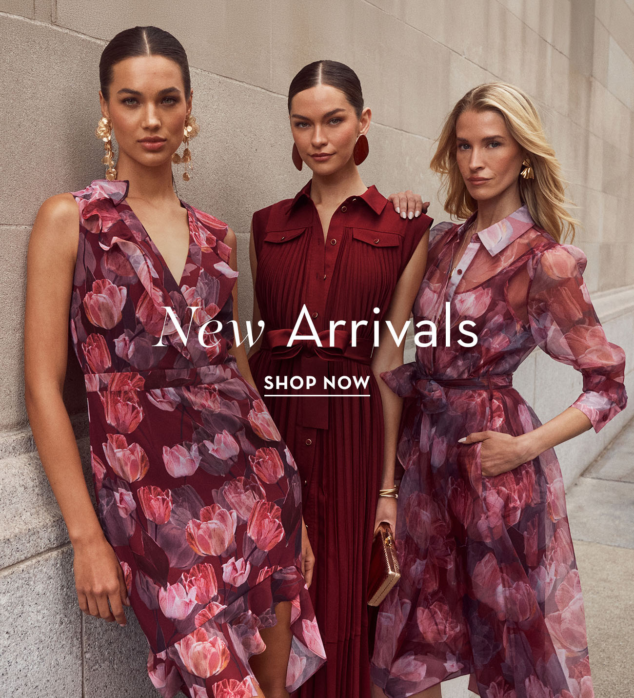 Three women in floral dresses promoting new arrivals.