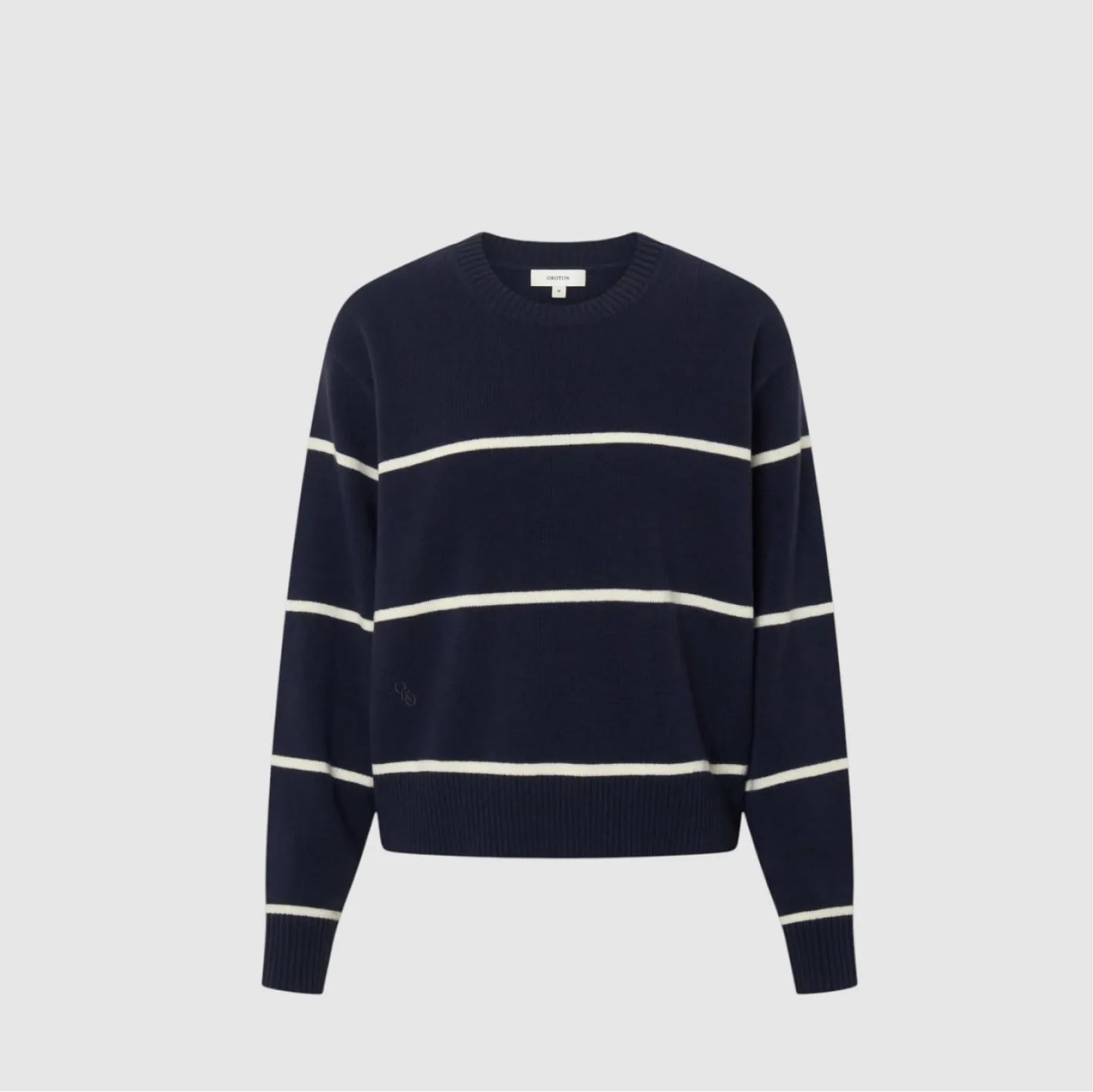 Navy striped sweater with white stripes on a light gray background.
