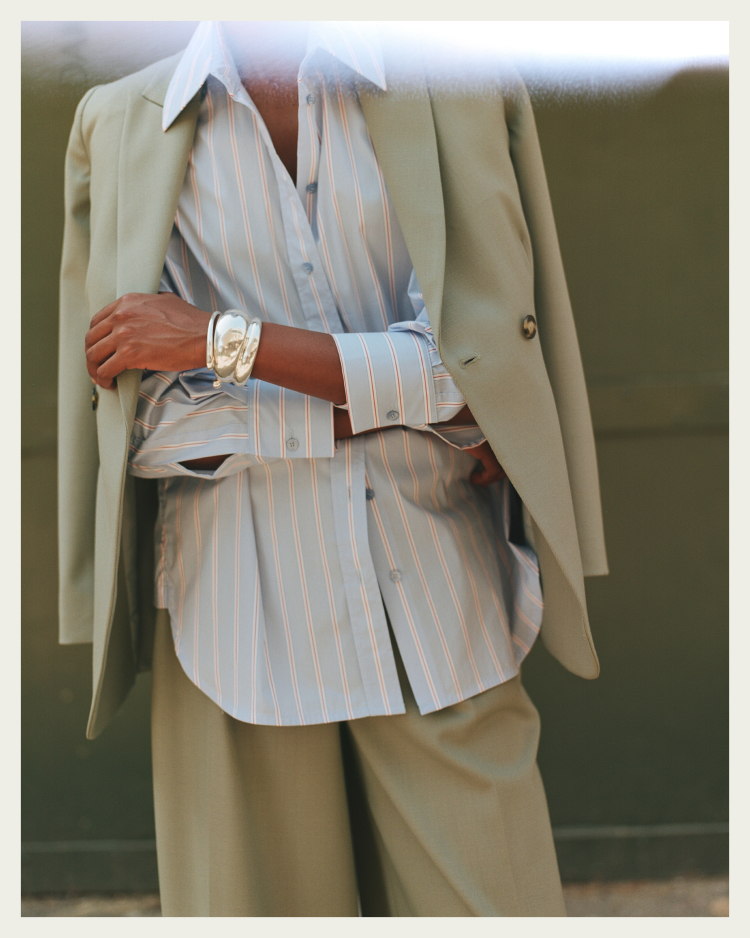 Model wearing Clever Crepe suiting and Claudia blue stripe shirt