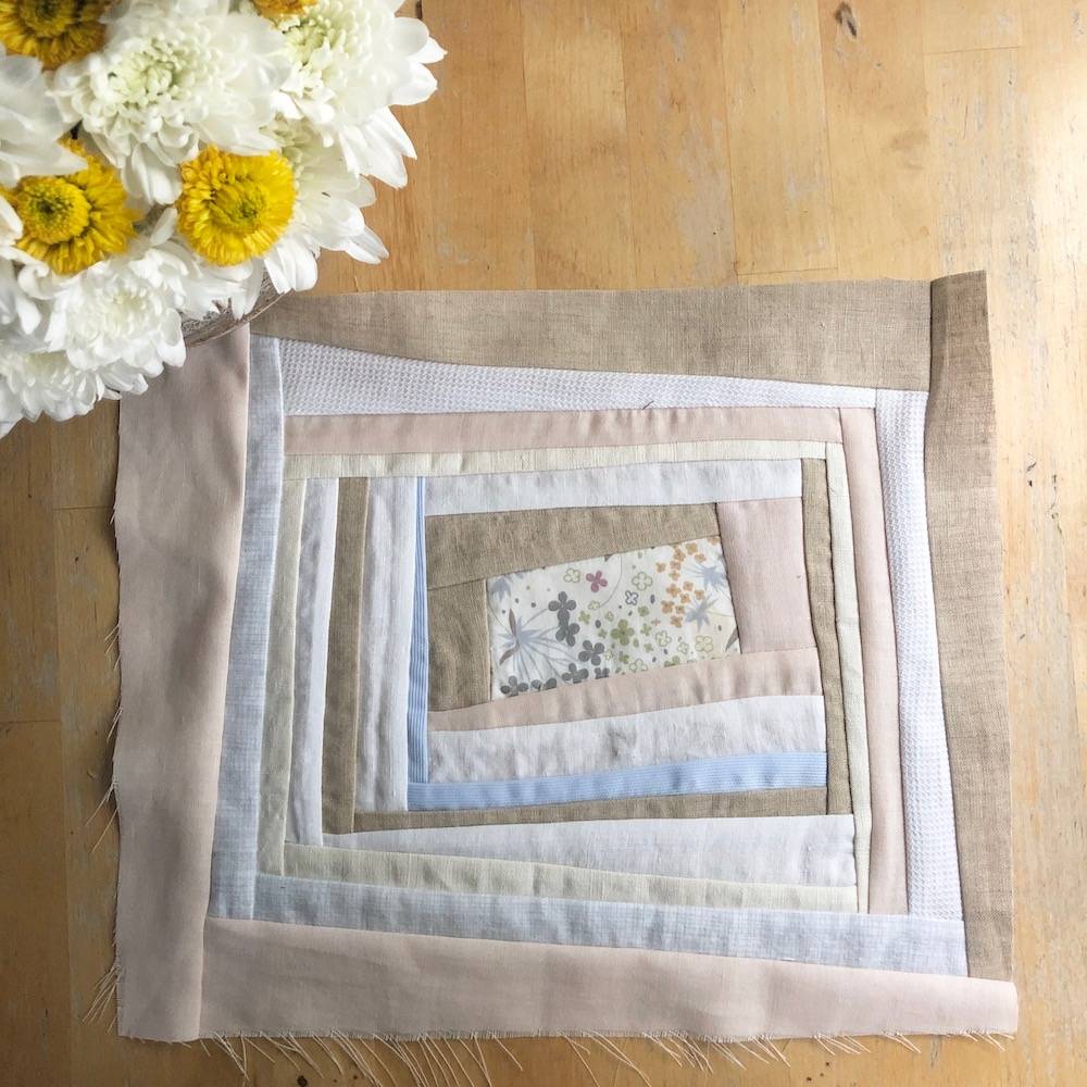 log cabin improvised quilt block with beige fabrics