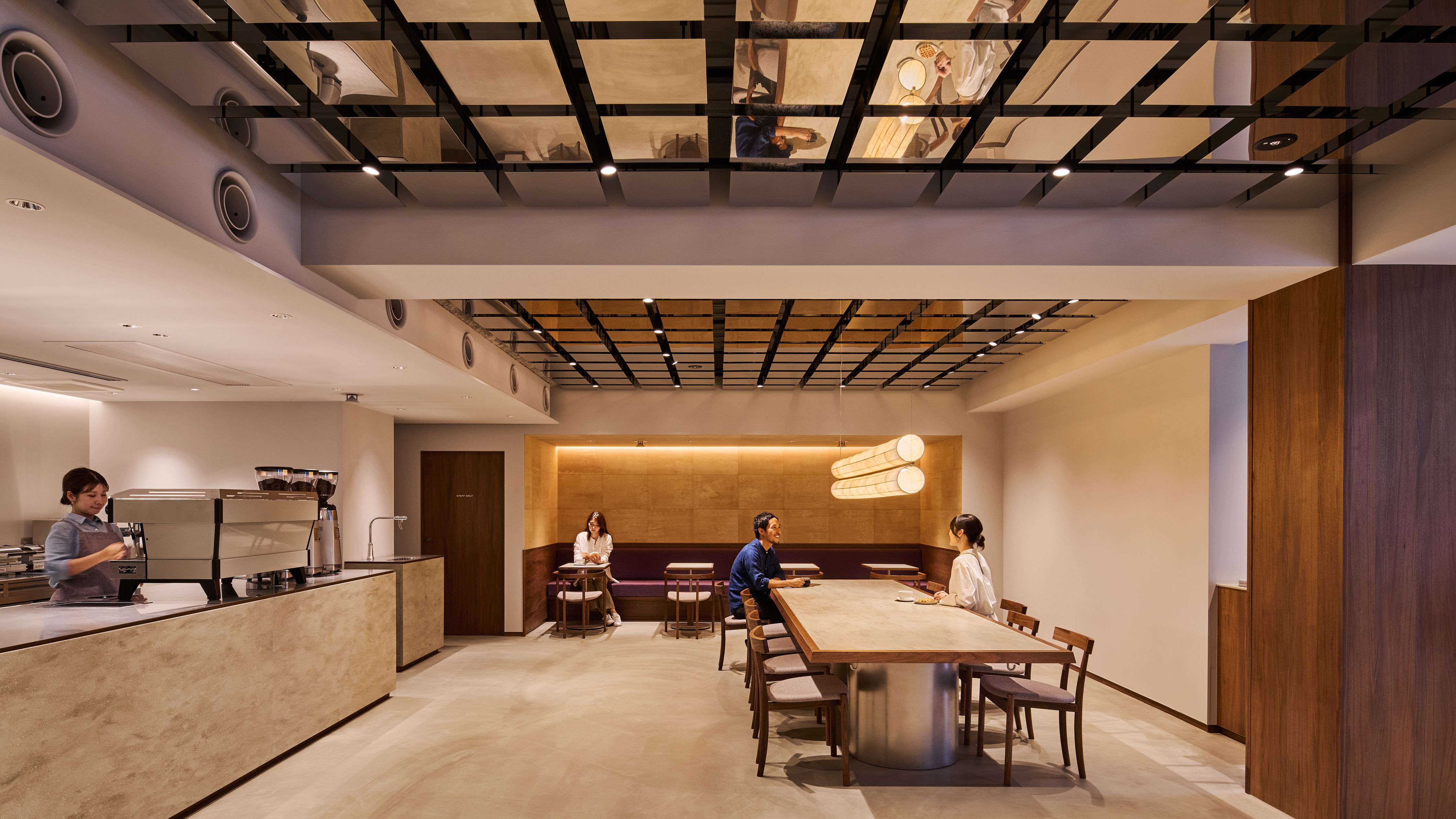 Modern interior of a cafe with wooden furniture and spacious layout.