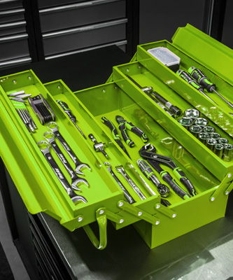 Open green toolbox filled with various tools and accessories.