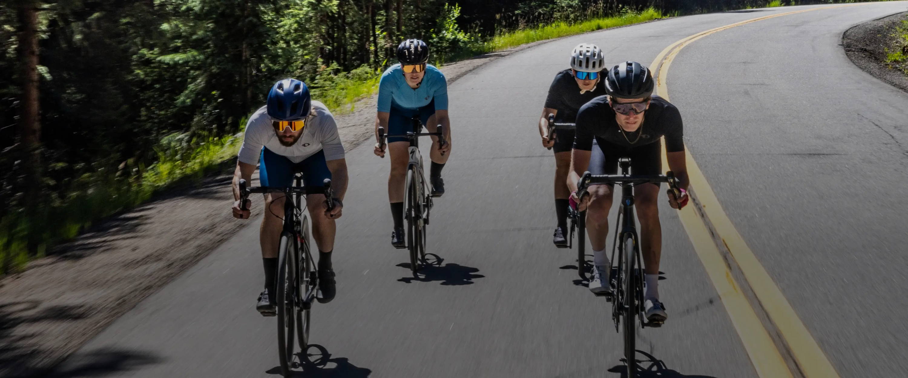 Group of road cyclists on a ride together rocking out in their PEARL iZUMi Attack kits
