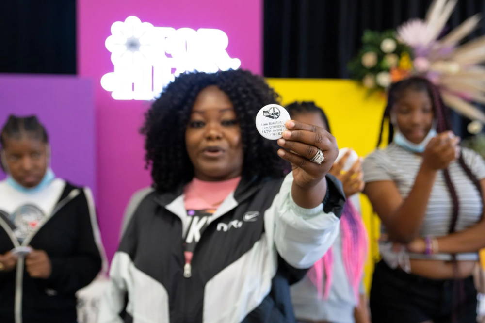 speaker holding for her sticker