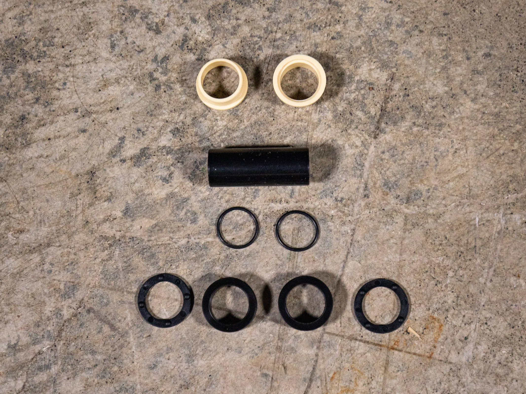 Fox Shox Mountain Bike Rear Shock Mounting hardware components layed out on the floor