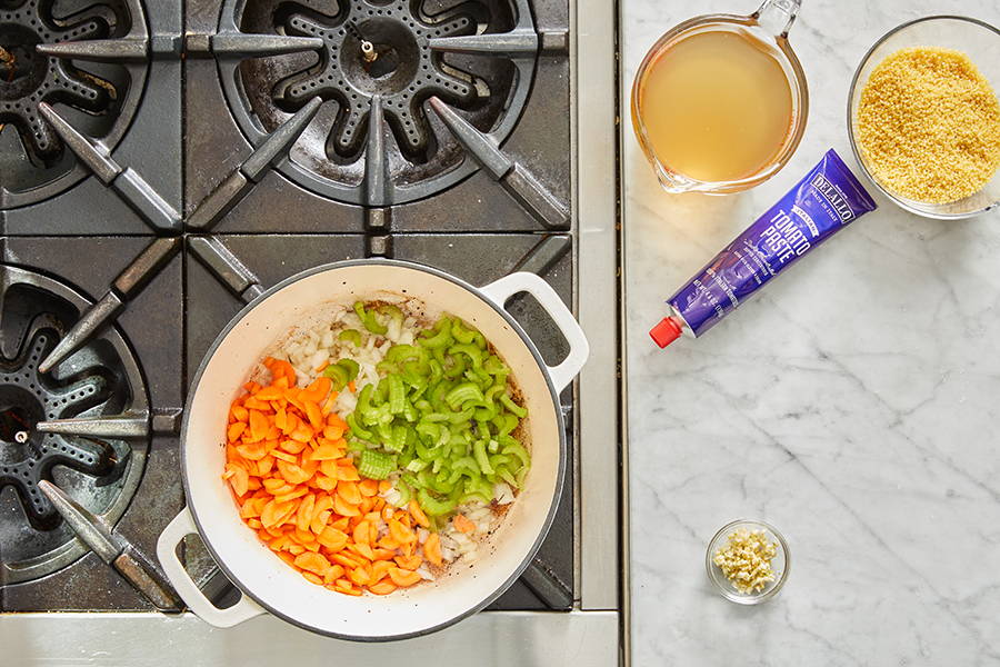 Carrots, celery, and onion added to pan