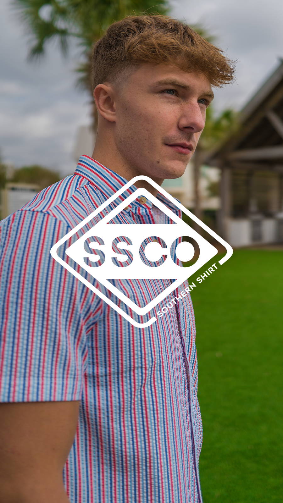 Young man wearing bright vertical striped button down shirt