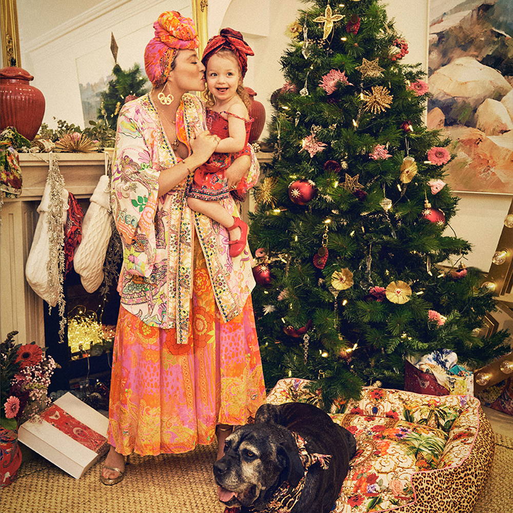 Camilla Franks and Luna next to Christmas Tree