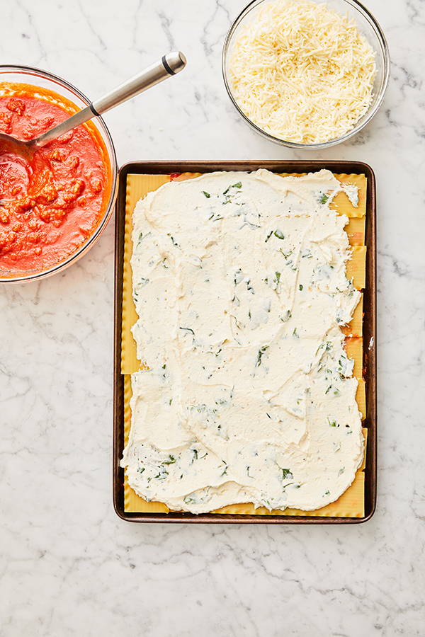 Ricotta spread out across pan