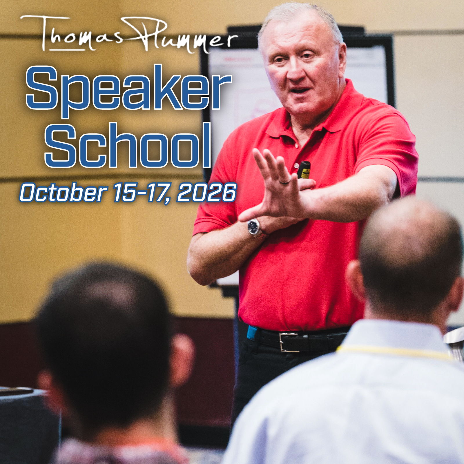 Man in red shirt speaking at Speaker School event, October 2026.