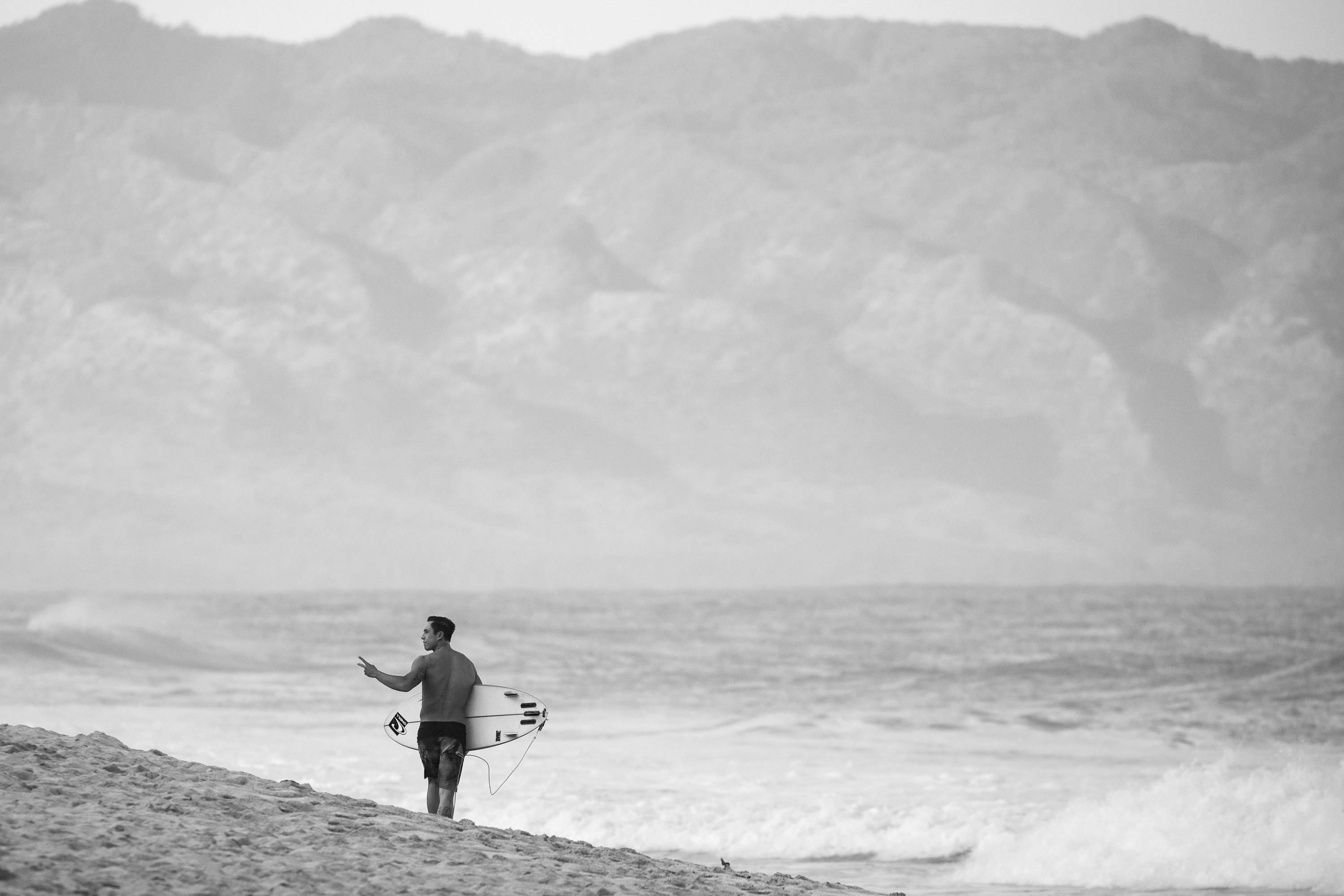 Eli Olson heading out to surf