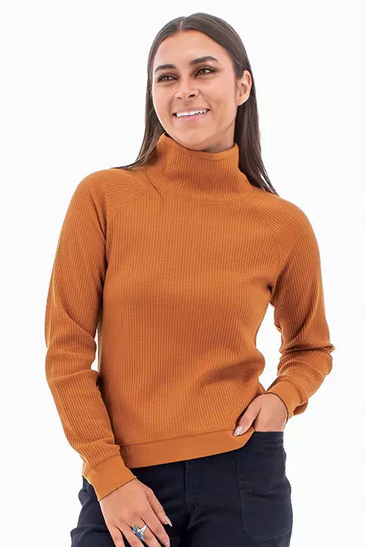 Detail view of the Remy pullover cowl neck sweater in orange.