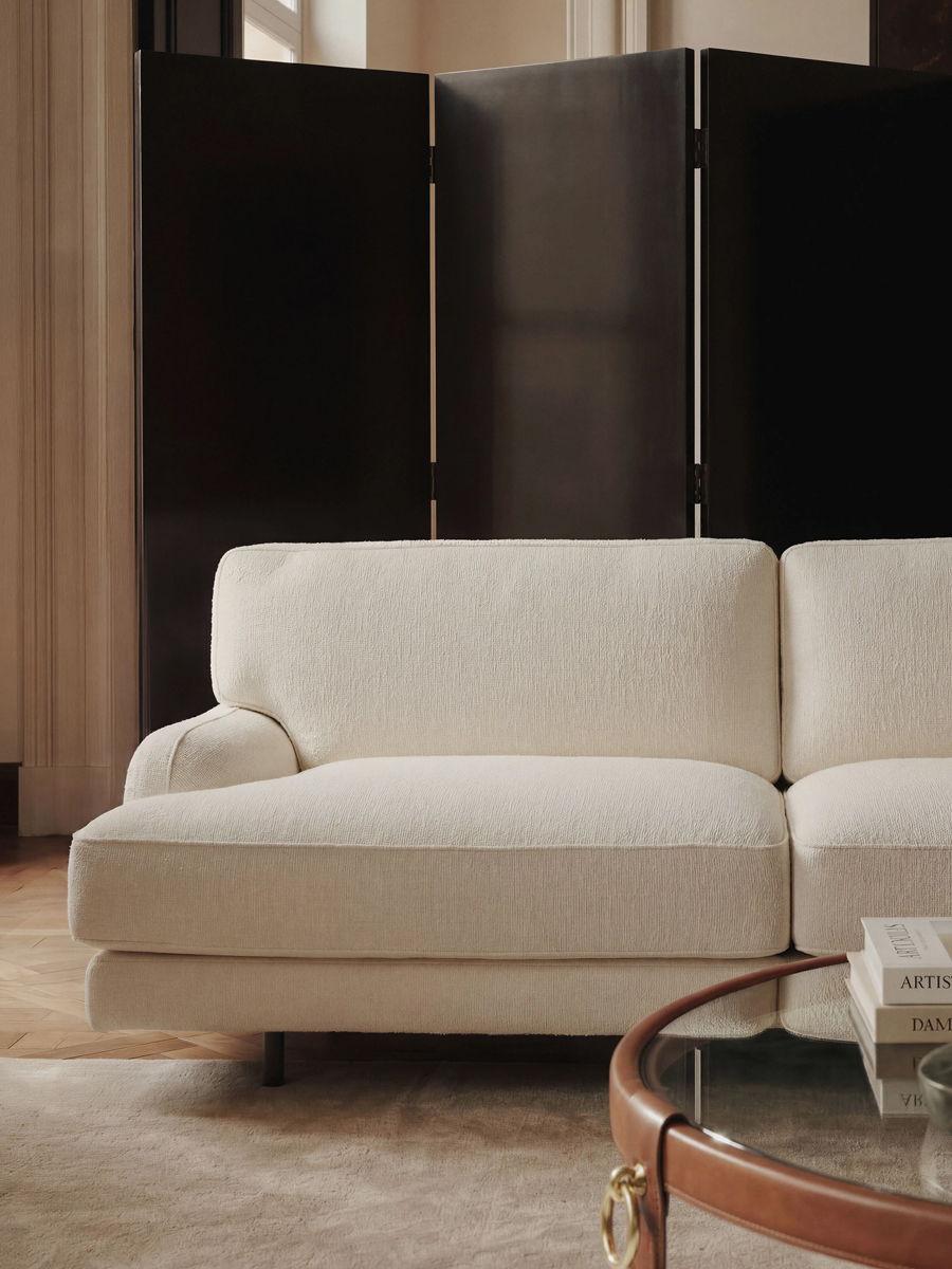 A modern, Gubi sofa in a stylish interior setting.