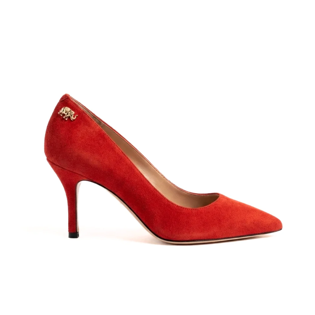 Red suede high heel shoe with a pointed toe.