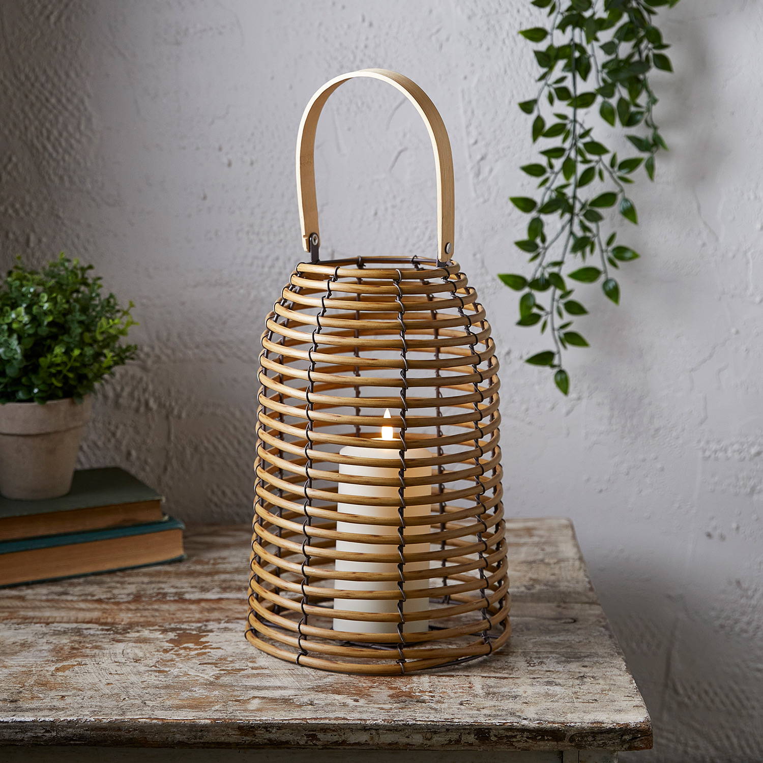 Rattan lantern illuminated on table