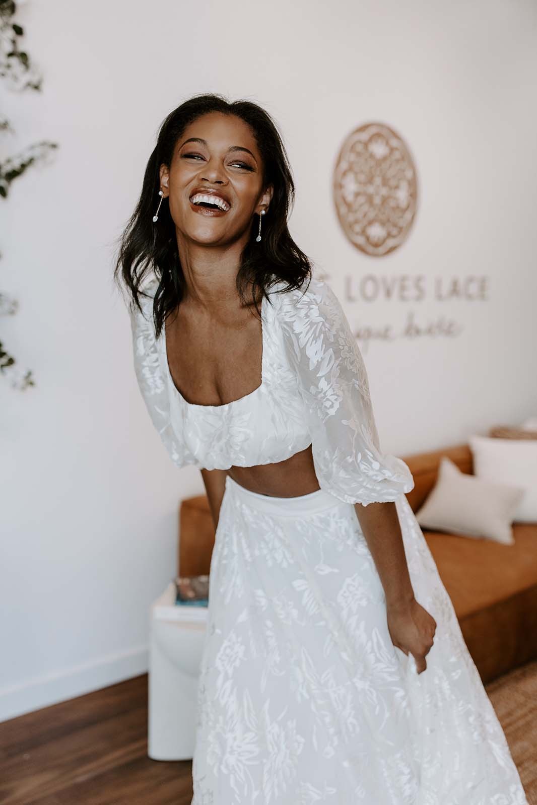 Bride laughing in her Grace Loves Lace set
