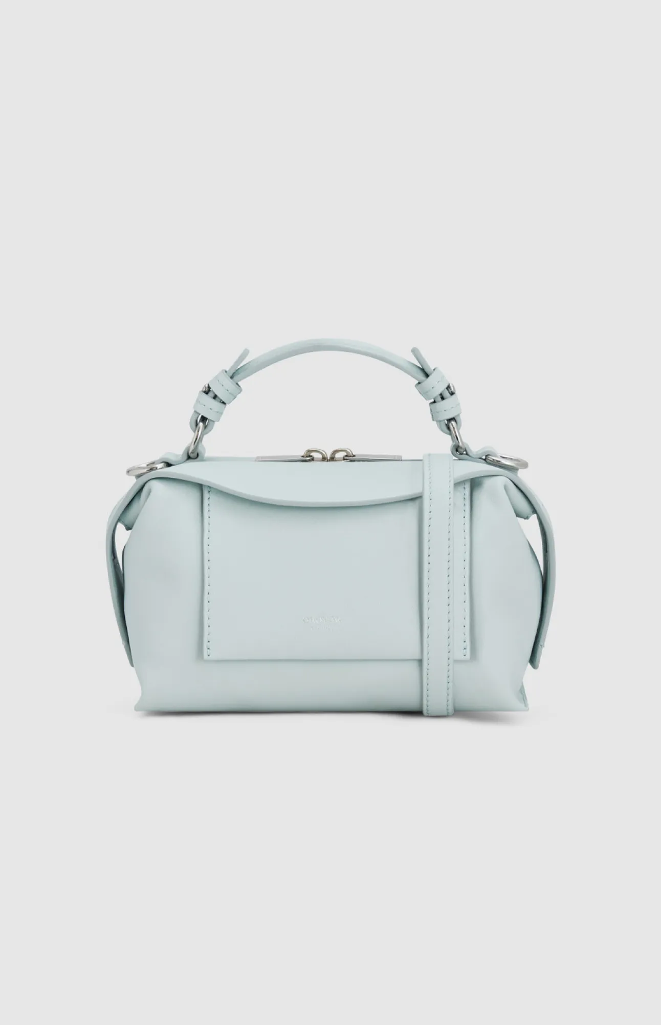 Light blue handbag with a top handle and adjustable strap.