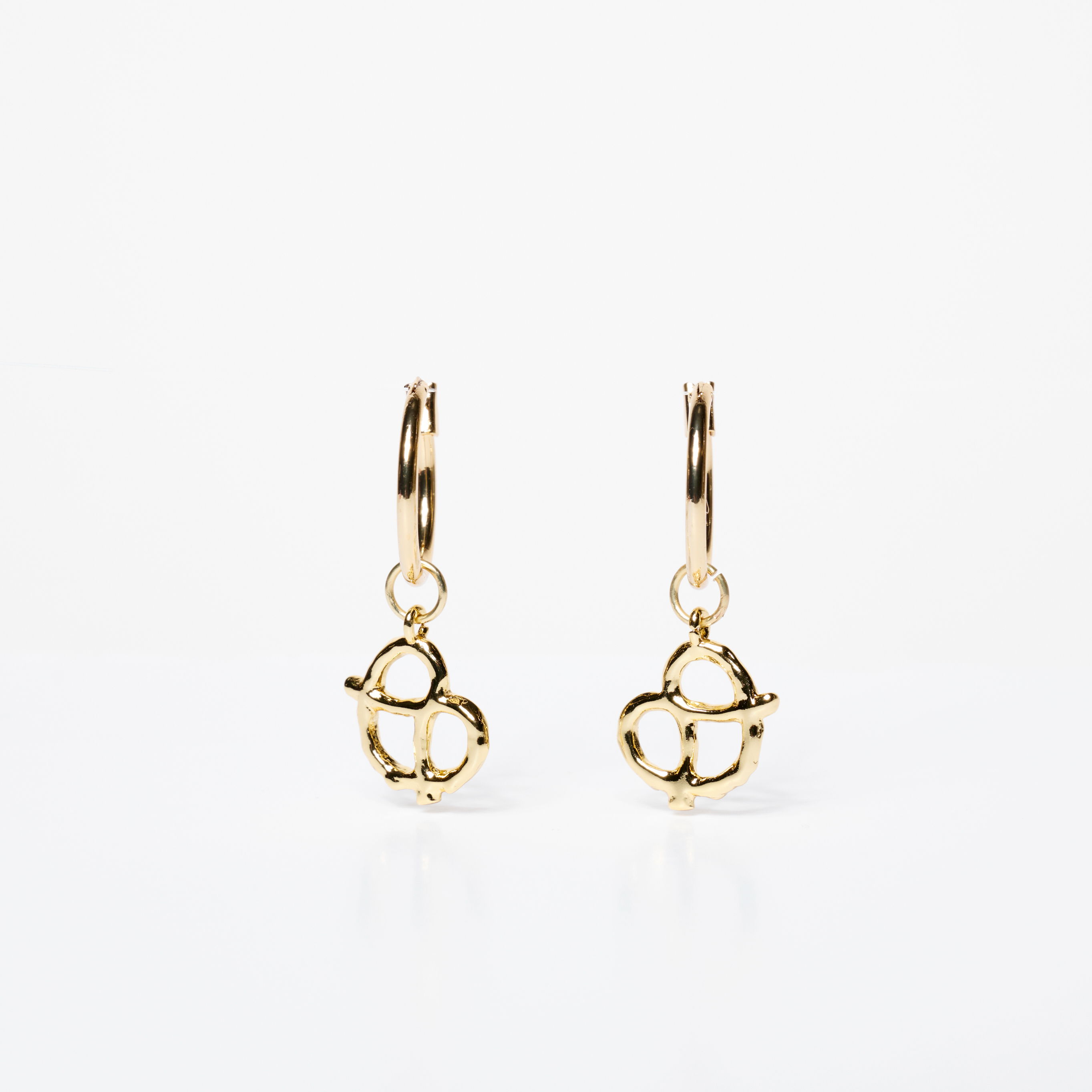 Gold hoop earrings with a pretzel design.