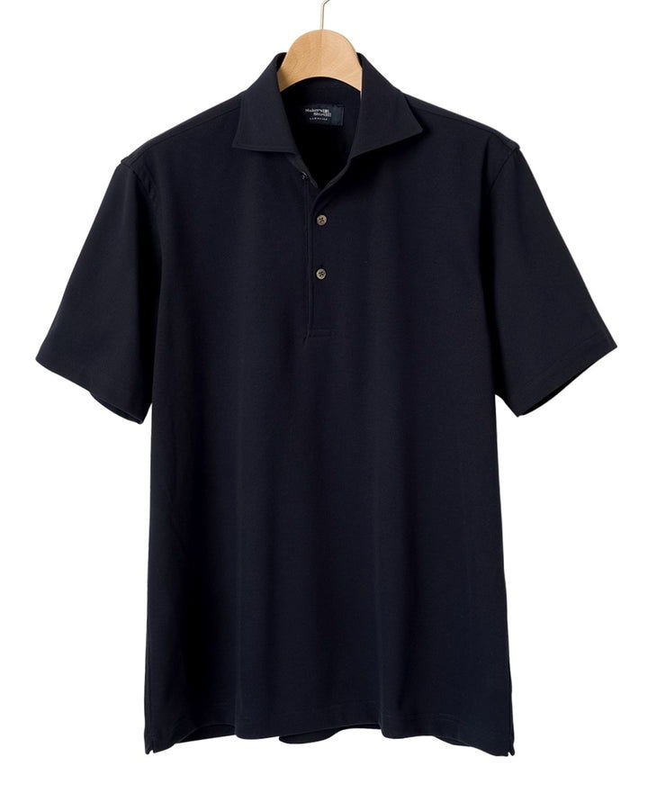 Black short-sleeve polo shirt hanging on a wooden hanger.