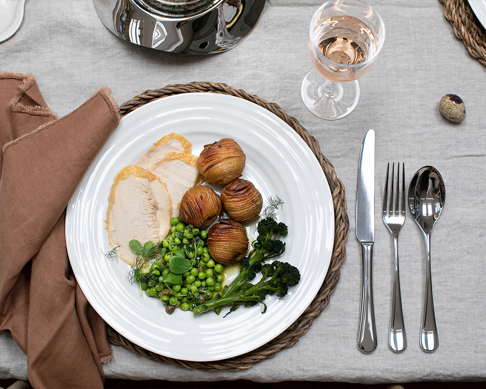 Herb roasted chicken with hasselback potatoes & garden peas with salsa verde
