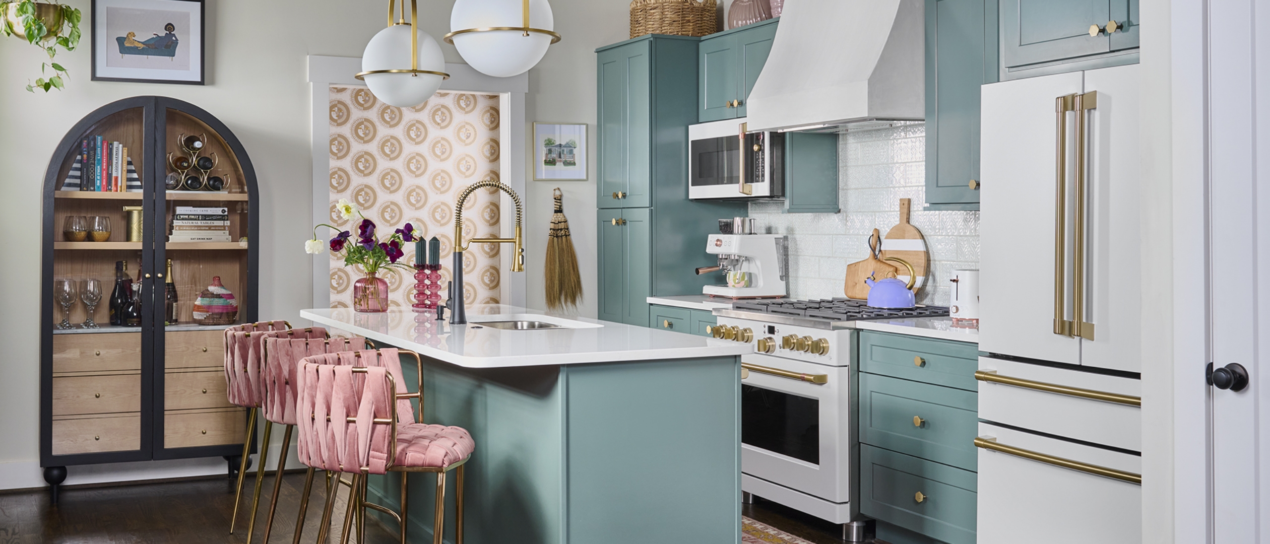 Blessed Little Bungalow kitchen with teal cabinets, matte white appliances, and pink bar stools.