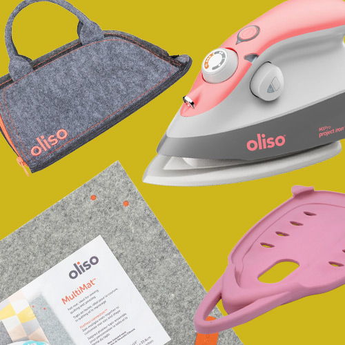 Iron, ironing mat, carrying case, and silicone iron rest on yellow background.
