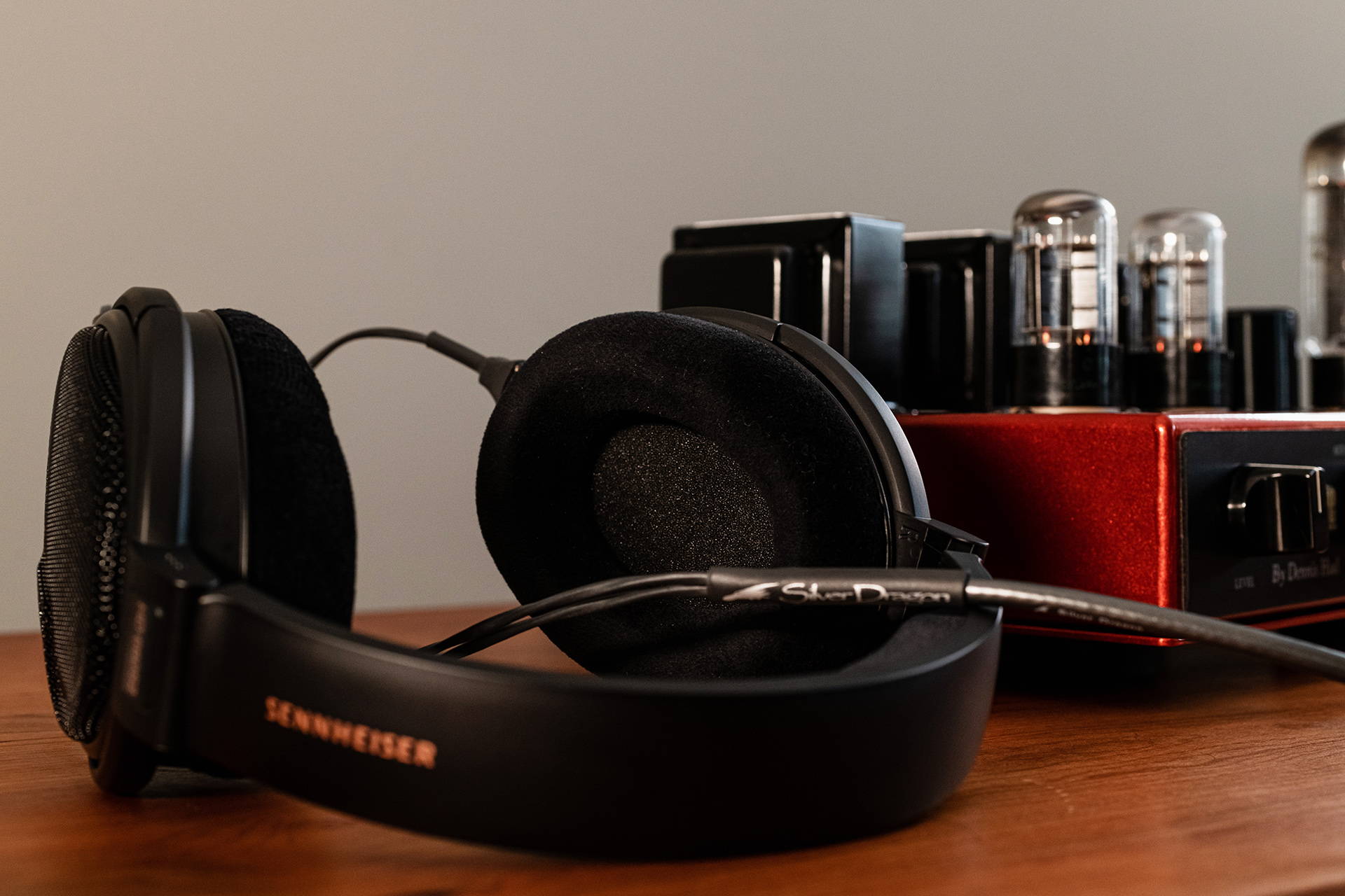 Sennheiser HD 660S2 with Silver Dragon Cable and Dragon Inspire headphone amp on a table