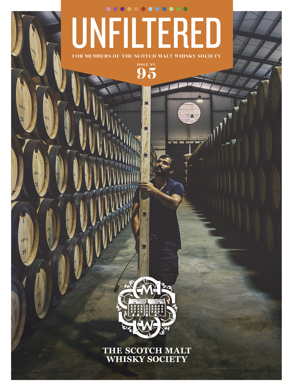 Magazine cover featuring whisky barrels and a man in a distillery.