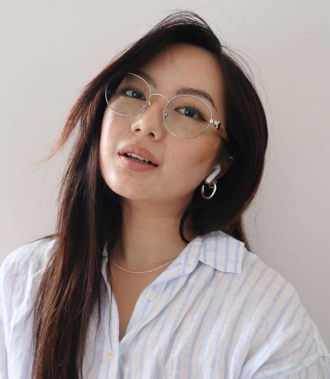asian woman wearing Joy Silver round metal low bridge glasses