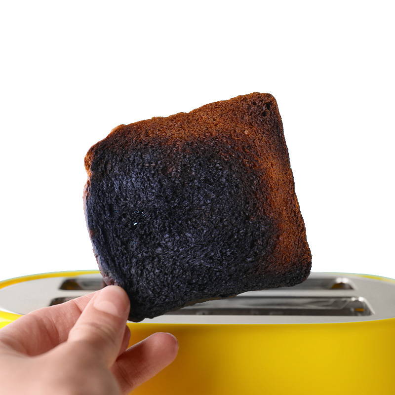 A photo of a burnt piece of toast