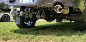 Rear view of Ryan's Dodge Ram 1500 showing B&W hitch, dual exhaust, and train horn kit