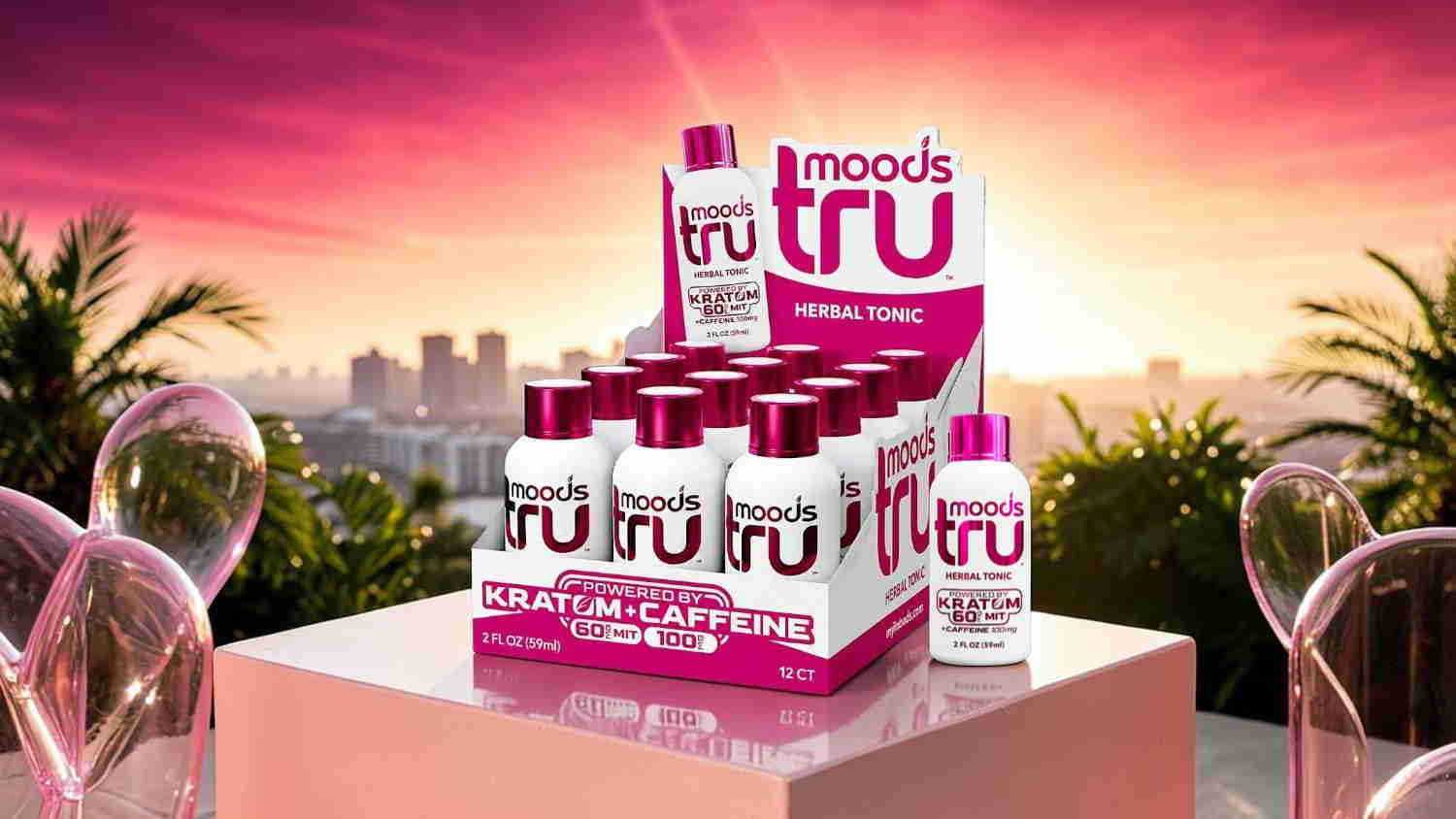 Product display of Tru drinks against a sunset background.