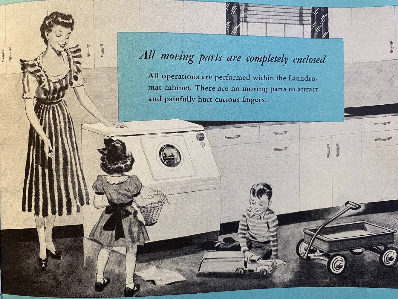 A black and white Mid-Century illustration featuring a woman in a mid -length sleeve striped dress and two children (a boy and a girl) inside a kitchen. The boy is playing with a toy truck while the girl holds a basket of laundry. The woman is standing to the left of the laundry machine and is resting her hand on it.
